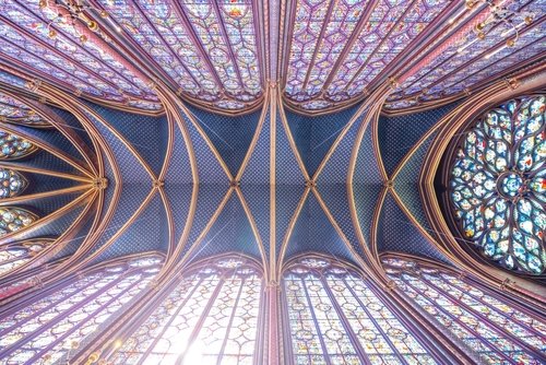 Monumental interior of Sainte-Chapelle with stained glass windows, upper level of royal chapel in the Gothic style. Palais de la Cite, Paris, France