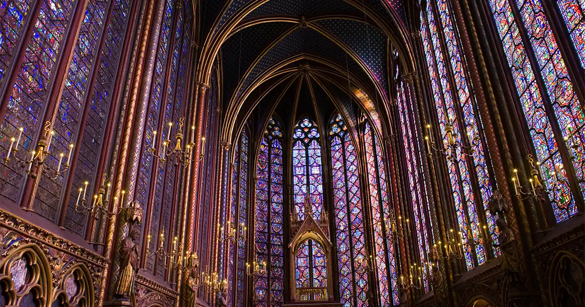 Famous stained glass windows and ceiling within La Sainte-Chapelle Chapel in Paris, France